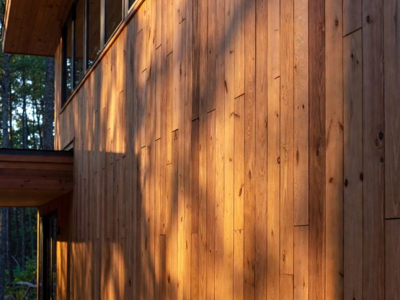 Natural cedar wood siding on a rustic house facade.