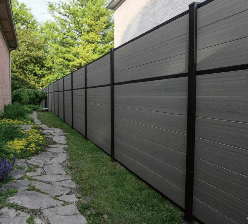 Image of a fence between two buildings made of wood composite