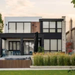 A backyard view of a North York home with ACM and WPC elements, a patio, and a hot tub.