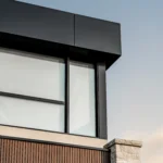 Angled close-up of a North York residence with WPC wood slats and an ACM top section.