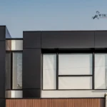 Architectural close-up of black ACM panels and WPC cladding on a North York home.