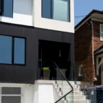 Full-frontal view of a home entrance featuring Toronto PVC & WPC Shadow Gap siding.