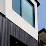 Side angle view of a Toronto PVC & WPC Shadow Gap installation.