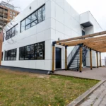Modern two‑story white ACM building with staircase and pergola in North York, Ontario