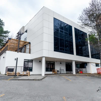 White ACM building with staircase and pergola in North York, Ontario