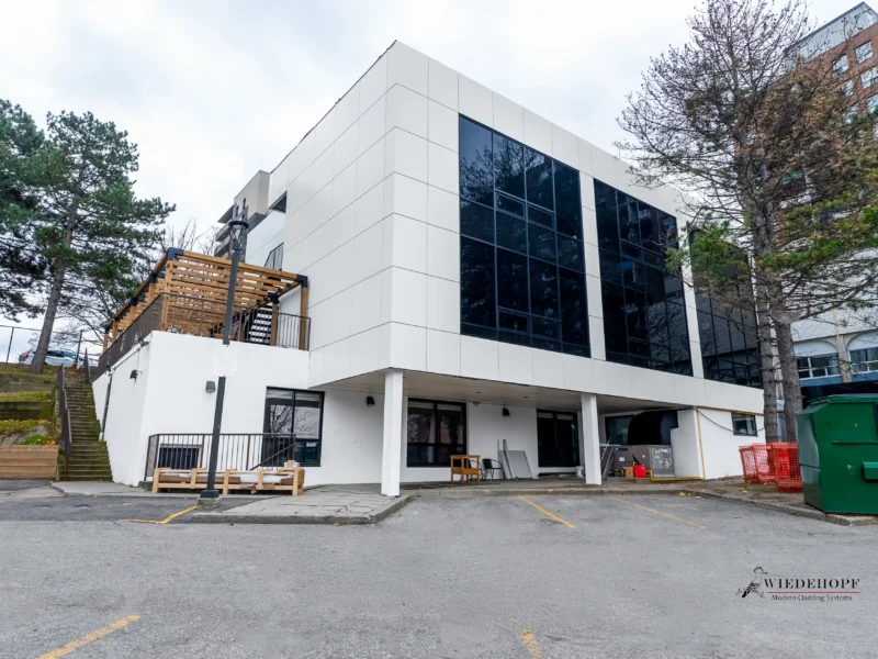 White ACM building with staircase and pergola in North York, Ontario