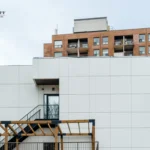 White ACM building with staircase and pergola in North York, Ontario