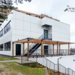 White ACM school building with staircase and pergola in North York, Ontario