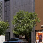 Winners & HomeSense store and Paris Baguette store front with gray and brown aluminum panels.
