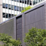 Building entrance "110 BLOOR" with brown, gray, and textured aluminum panels.