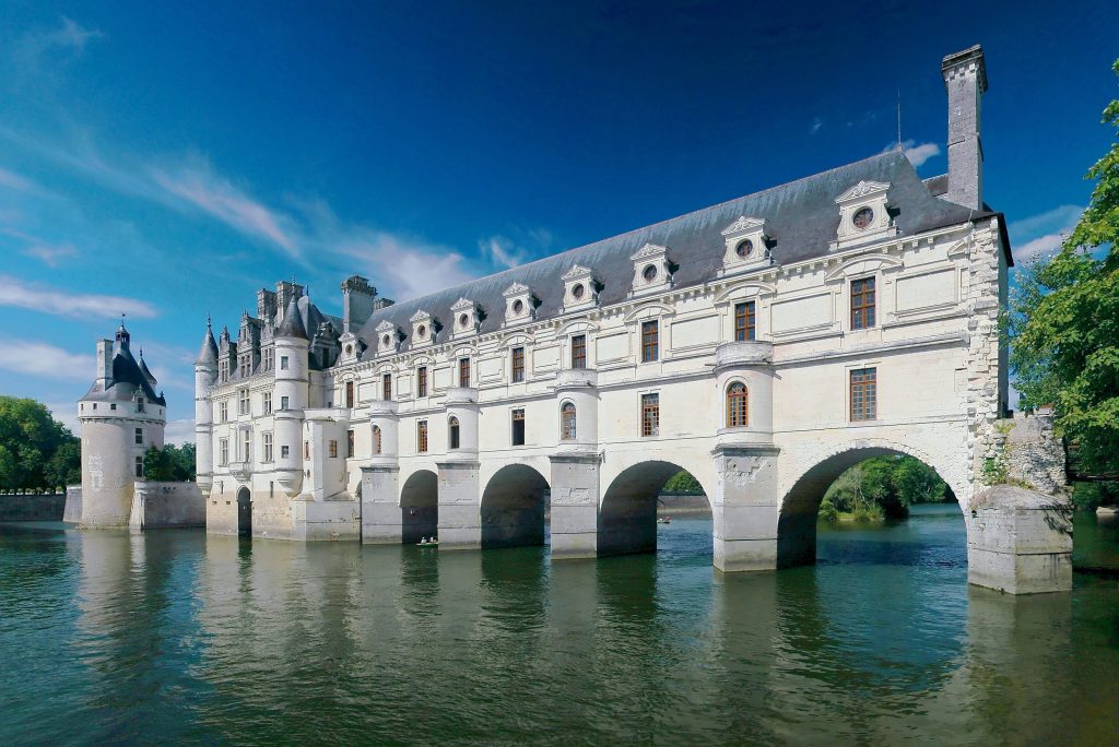 Château de Chenonceau in France spanning the River Cher, known for elegant arches, balanced proportions, and refined façade design